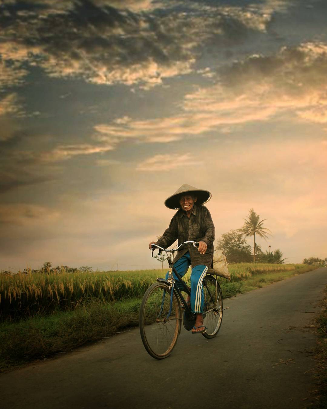 Indonesia Old Man Riding Bike
