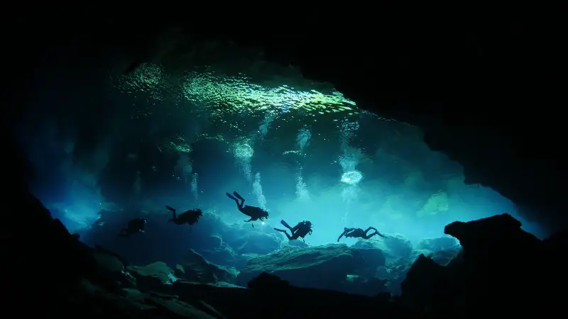 Divers in an underwater cave
